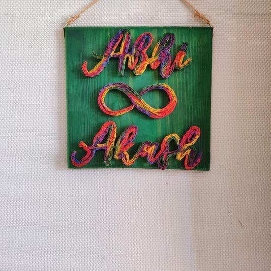 Technicolor Romance: Colorful Couple Name String Art Wall Decor
