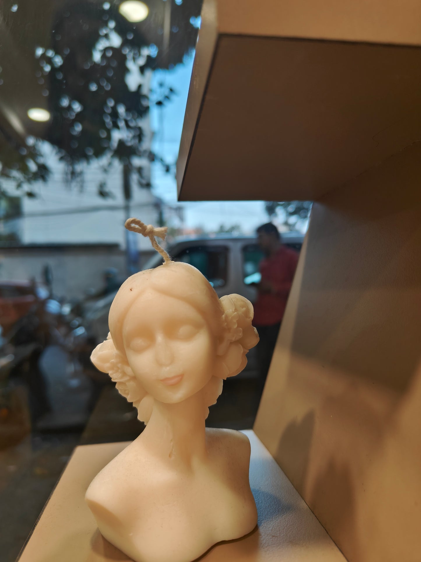 Whimsical Glow: Dool Shaped Candle