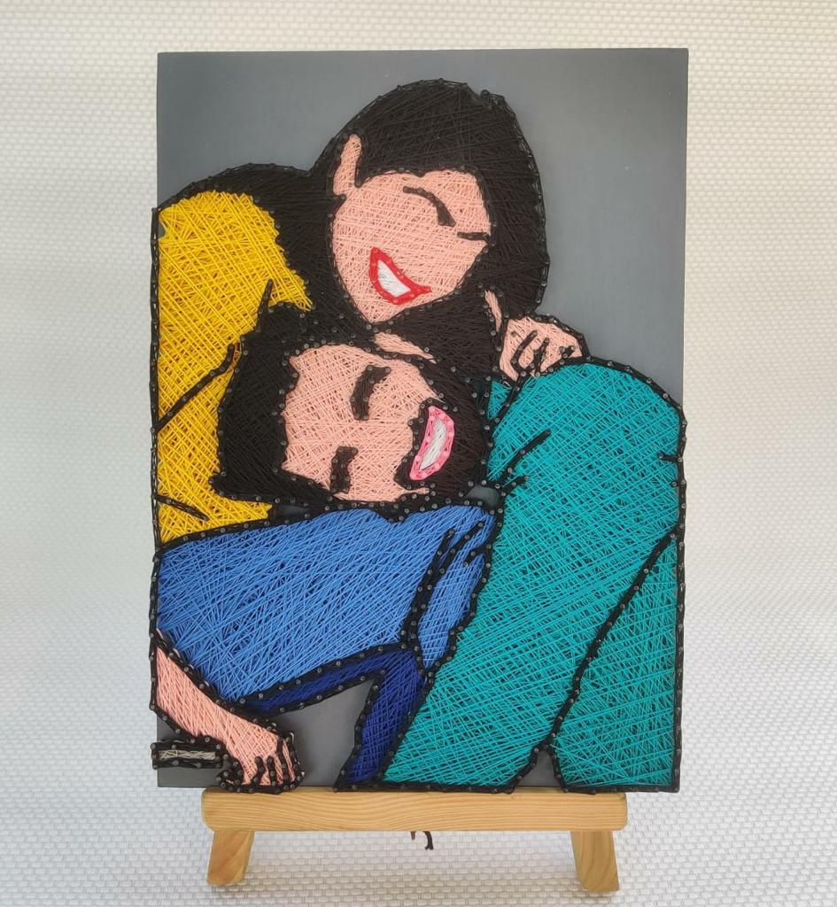 Technicolor Ties: Colorful String Art Celebrating Couples' Connection