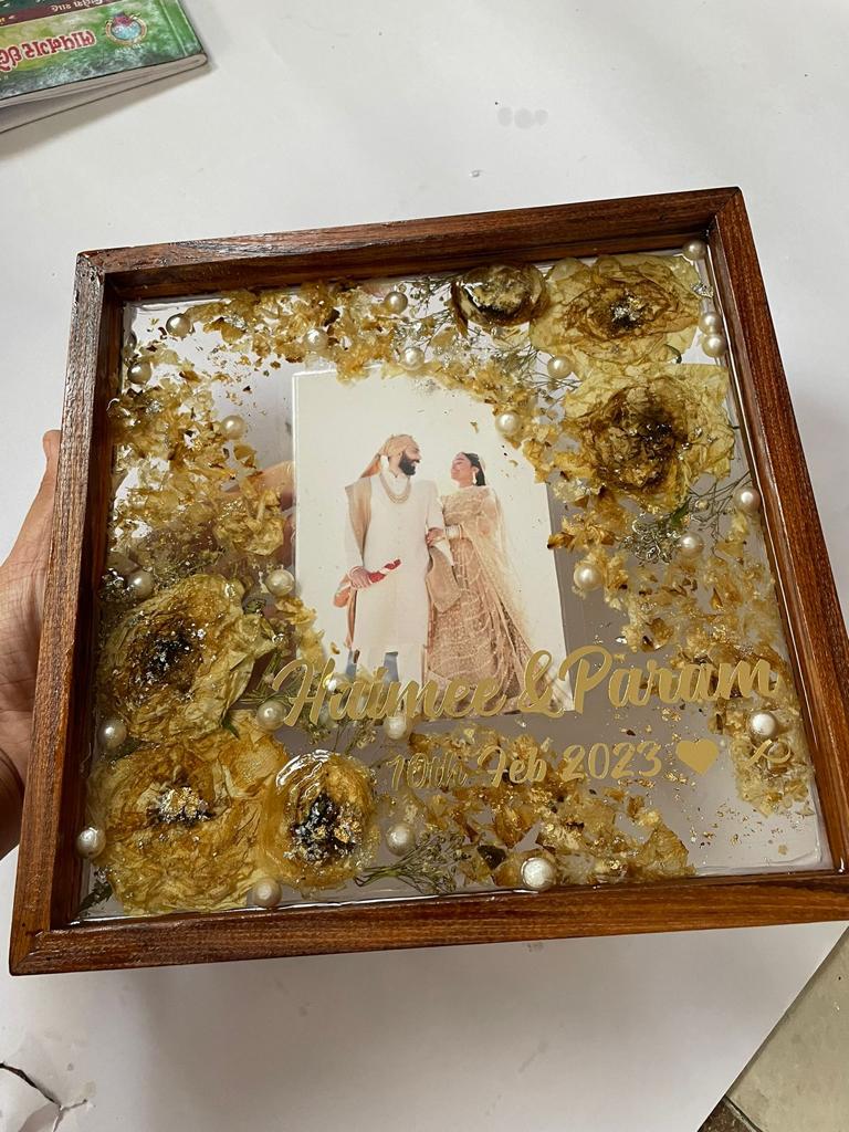 Love's Forever Frame: Resin Varmala Preservation in Wooden Frame with Couples' Picture