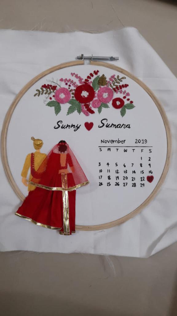 Love and Time: Artistic Couple Wedding Hoop Art with Stitched Flowers and Calendar