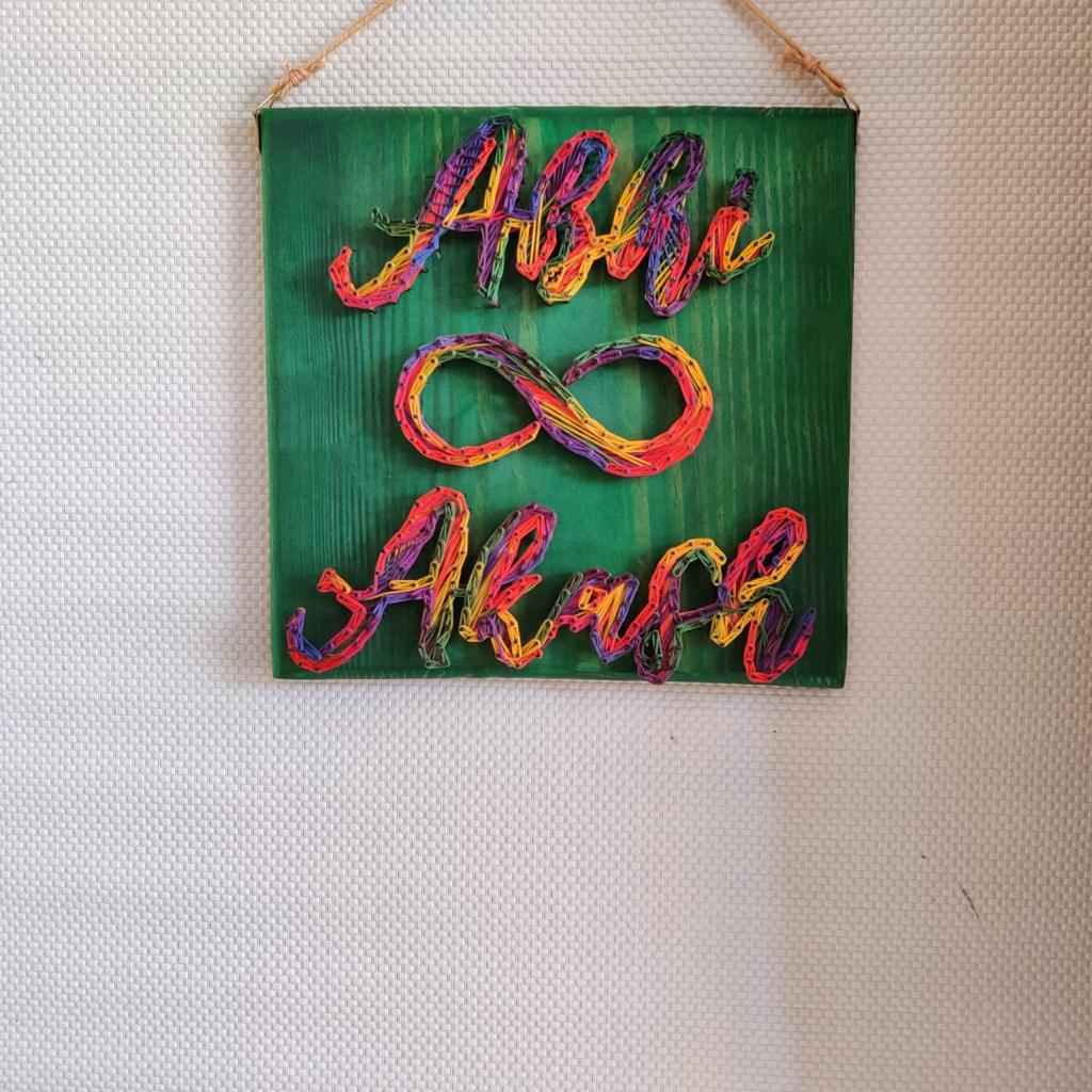 Technicolor Romance: Colorful Couple Name String Art Wall Decor